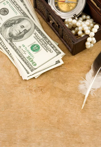 Feather and dollars — Stock Photo, Image