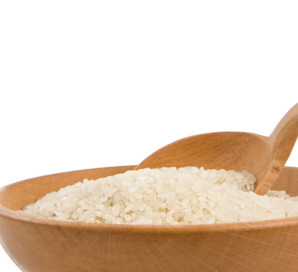 Ryż w płytkę i łyżka białego na białym tle na — Zdjęcie stockowe