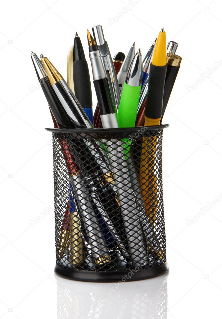 Colorful pens in holder isolated on white Stock Photo by ©seregam