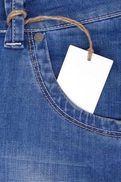 Precio tag over jeans textured pocket —  Fotos de Stock