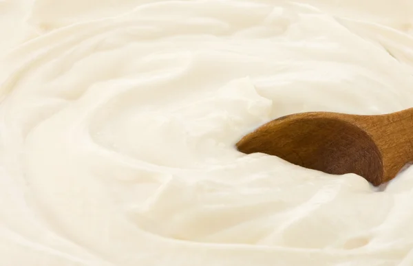 Spoon in sour cream — Stock Photo, Image