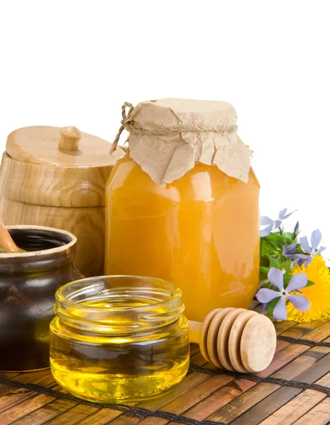 Pot of honey isolated on white — Stock Photo, Image