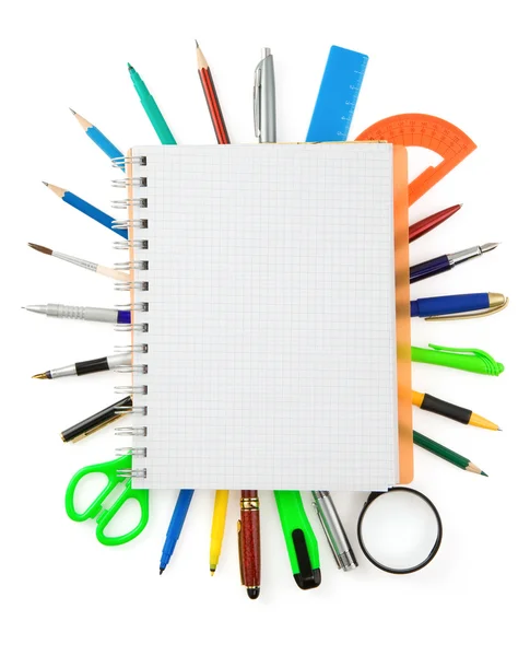 School supplies and checked notebook on white — Stock Photo, Image