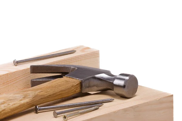 Hammer and nail on wood — Stock Photo, Image