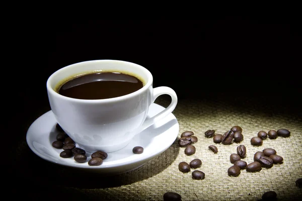 Šálek kávy, fazole a pytel — Stock fotografie