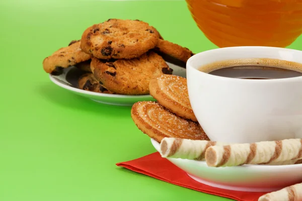 Coffee, honey and cookies on green — Stock Photo, Image