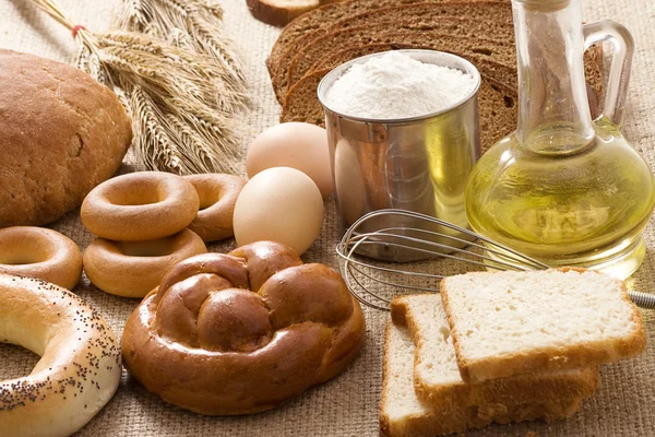 Bread, oil, pike with eggs on sacking — Stock Photo, Image