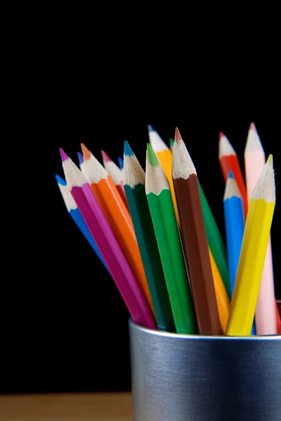 Pencils in a jar on black background — Stock Photo, Image