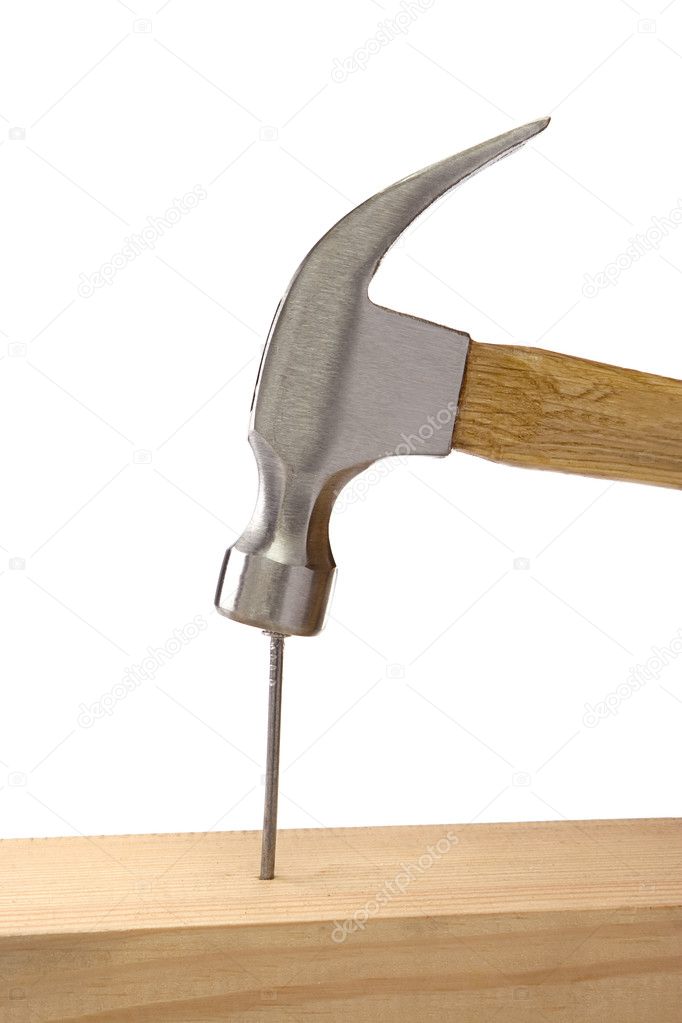 Hammer and nail isolated on white