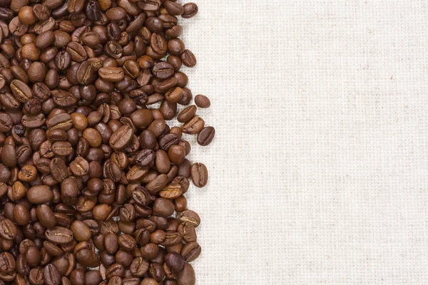 Textile and coffee beans — Stock Photo, Image