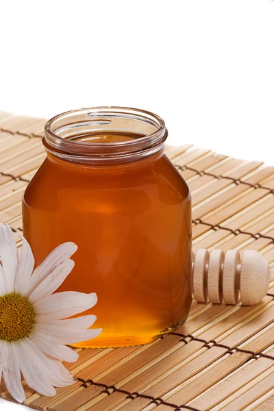 Glass pot of honey — Stock Photo, Image