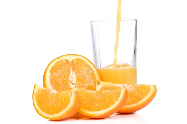 Tasty orange and outpouring juice — Stock Photo, Image
