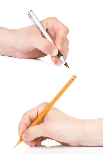 钢笔和铅笔在手 免版税图库图片