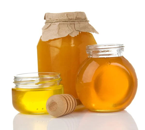 Glazen pot met honing en stok — Stockfoto