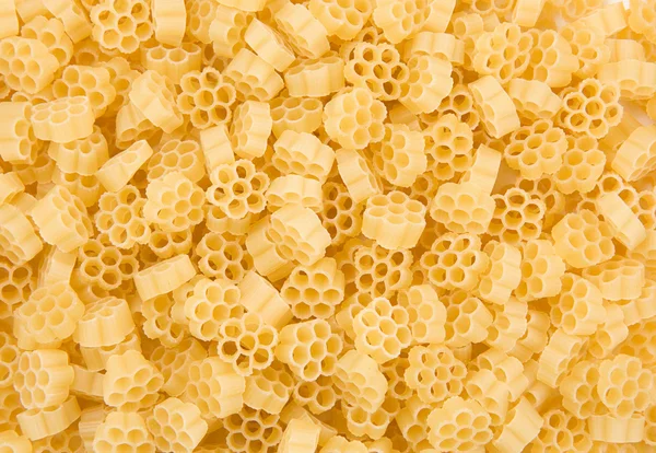 Raw pasta as background — Stock Photo, Image