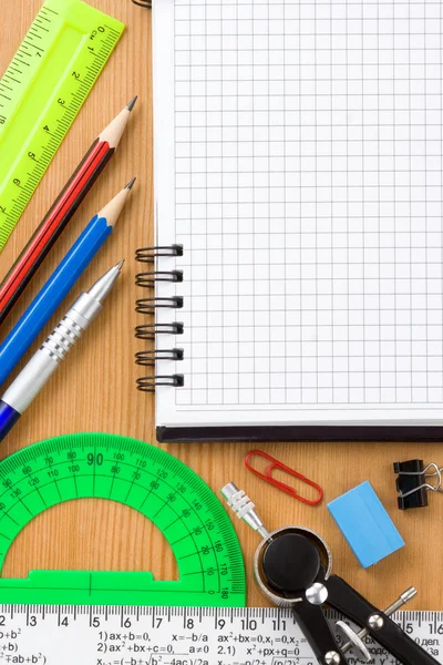Back to school and supplies near checked notebook — Stock Photo, Image