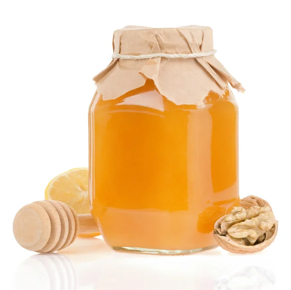 Βάζο με μέλι και λεμόνι που απομονώνονται σε λευκό — Φωτογραφία Αρχείου