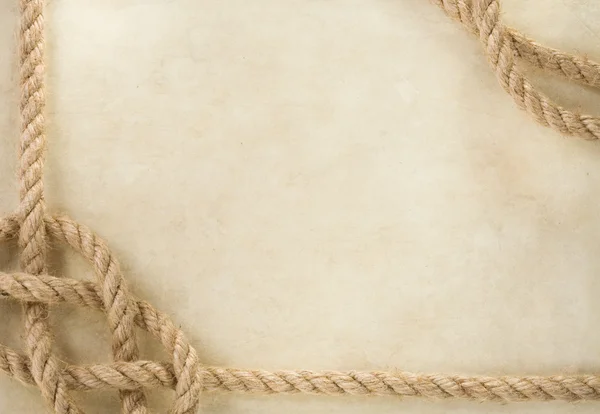 古いヴィンテージの古代の紙の背景でロープ — ストック写真