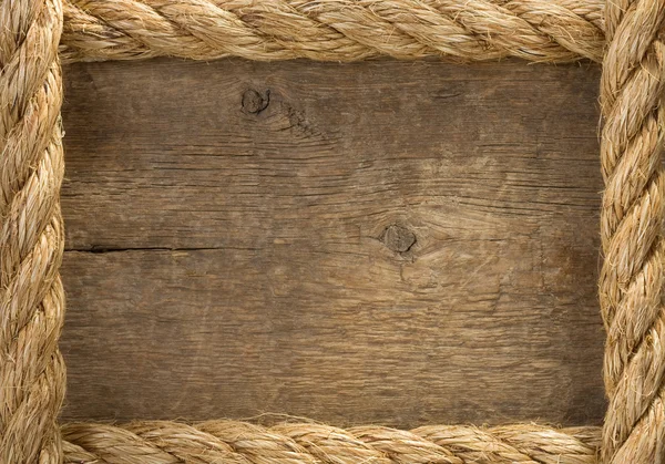 Statek liny granic na tle drewna — Zdjęcie stockowe