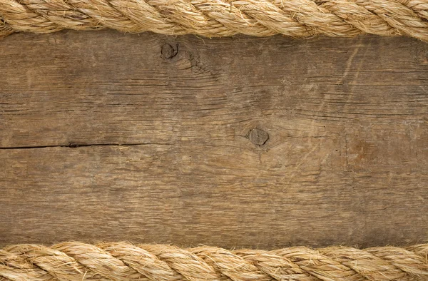 Schip touwen grenzen op hout achtergrond — Stockfoto