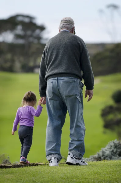 Grandfather plays with grand daughter — Stock Photo, Image