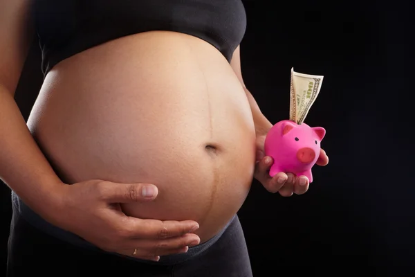 Pregnancy and piggy bank — Stock Photo, Image