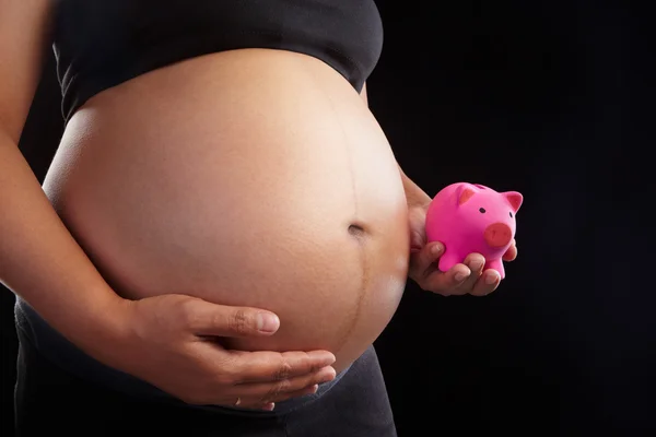 Zwangerschap en piggy bank — Stockfoto
