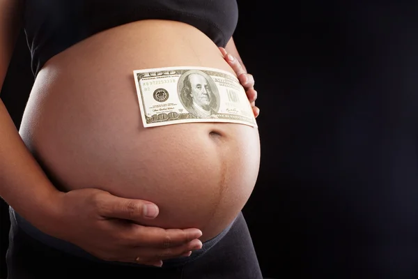 怀孕和美元 — 图库照片