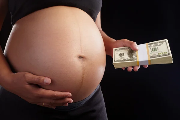 stock image Pregnancy and dollar