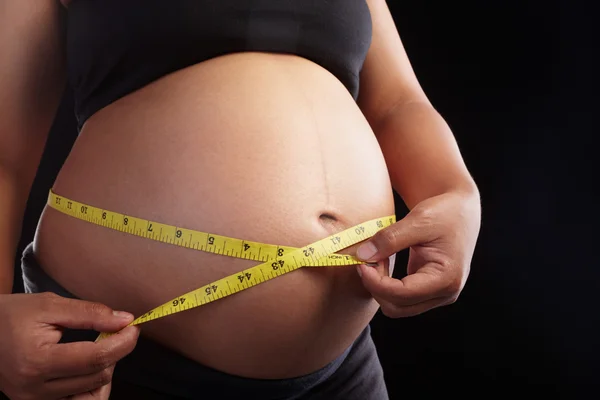 Ciąży i taśma miernicza — Zdjęcie stockowe