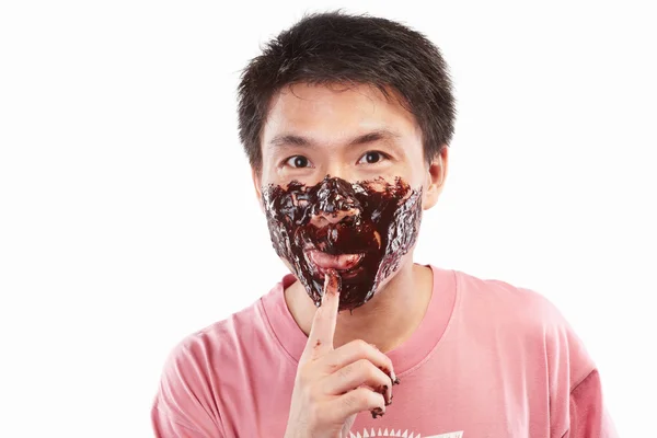 Asiatiska man och choklad spridningen — Stockfoto