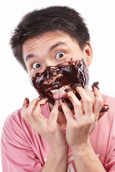 Азиатский мужчина и шоколад — стоковое фото