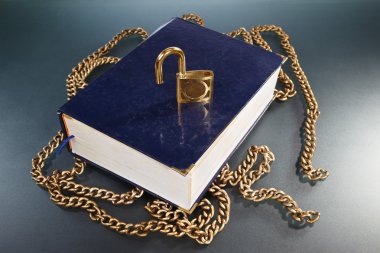 Book with golden chain and lock clipart