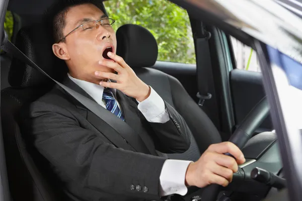 Yawning while driving — Stock Photo, Image
