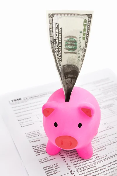 Piggy bank and tax forms — Stock Photo, Image