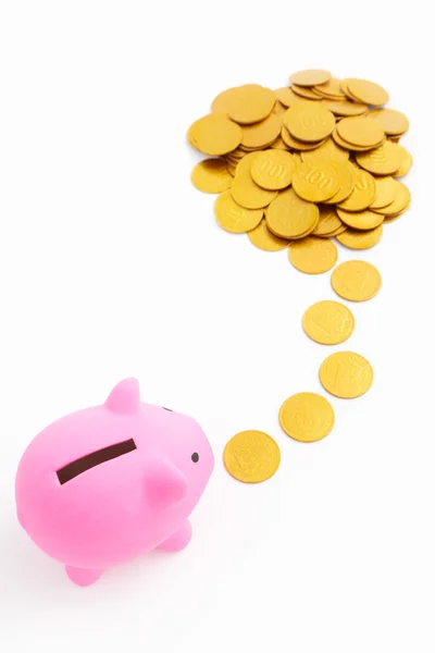 Piggy bank en gouden munten — Stockfoto