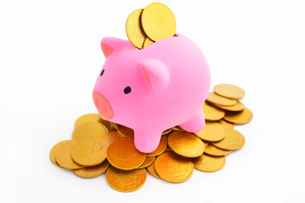 Piggy bank en gouden munten — Stockfoto
