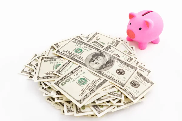 Piggy bank en stack o dollar — Stockfoto