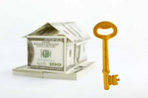 House shaped dollars and golden key — Stock Photo, Image