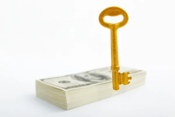 Floating golden key and dollar — Stock Photo, Image