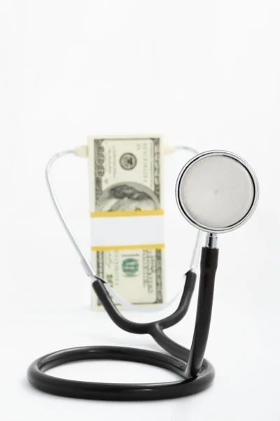 Dolaru a stetoskopem — Stock fotografie