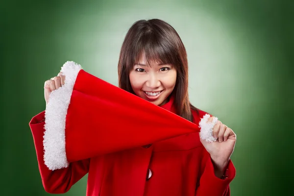 Christmas girl posing with santa hat — Stock Photo, Image