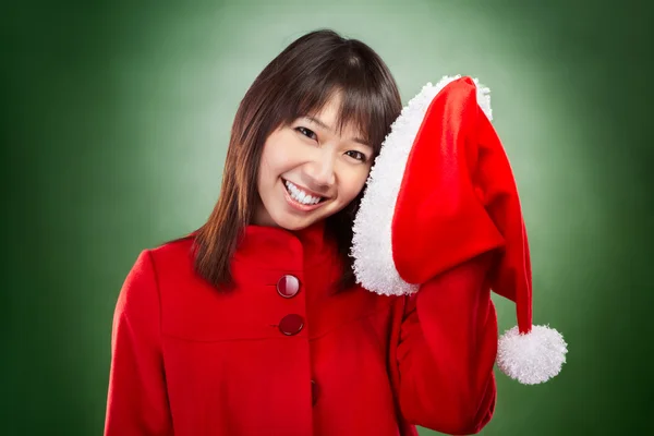 Noel Baba şapkası ile poz Noel kız — Stok fotoğraf