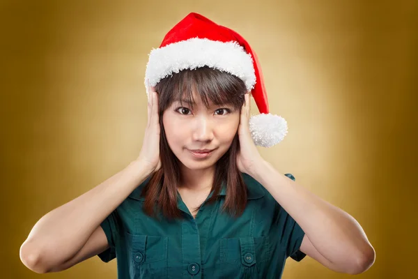 Müzik Noel Baba şapkası ile kız — Stok fotoğraf