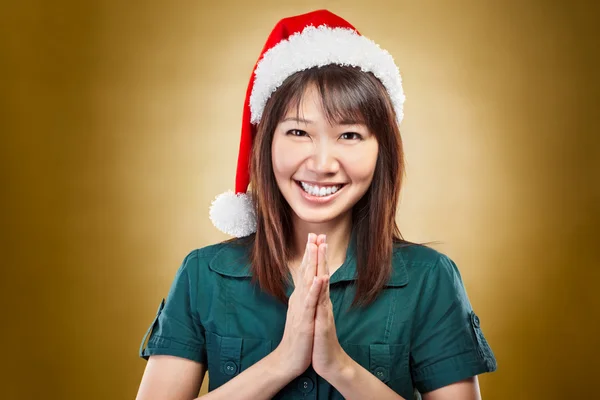 Girl with santa hat greeting — Stock Photo, Image