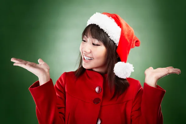 Christmas girl with choice — Stock Photo, Image