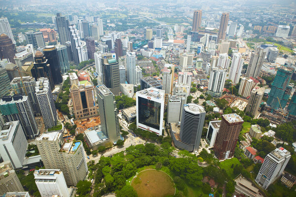 Kuala Lumpur, Malaysia - September 17th, 2011 : Cityscape taken from KL Tower observation desk, shot through the glass on observation floor