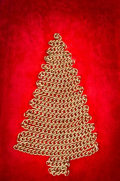 Gouden ketting kerstboom op rode — Stockfoto