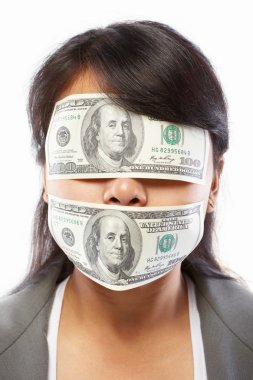 Businesswoman being blinded with money clipart