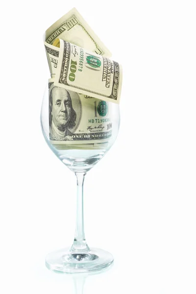 Copo de vinho cheio de notas de dólar — Fotografia de Stock